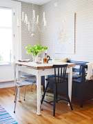 Chairs and bench next to a table