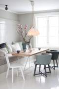 Chairs and bench next to a table