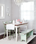 Chairs and bench next to a table