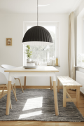 Chairs and bench next to a table