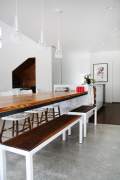 Chairs and bench next to a table