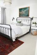 Iron bed in bedroom