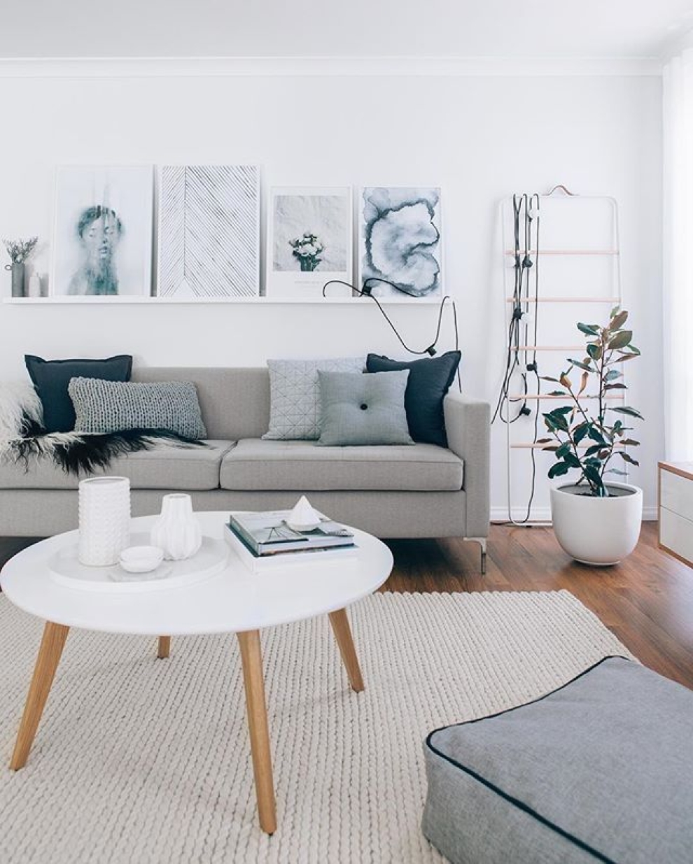 shelf for paintings above sofa