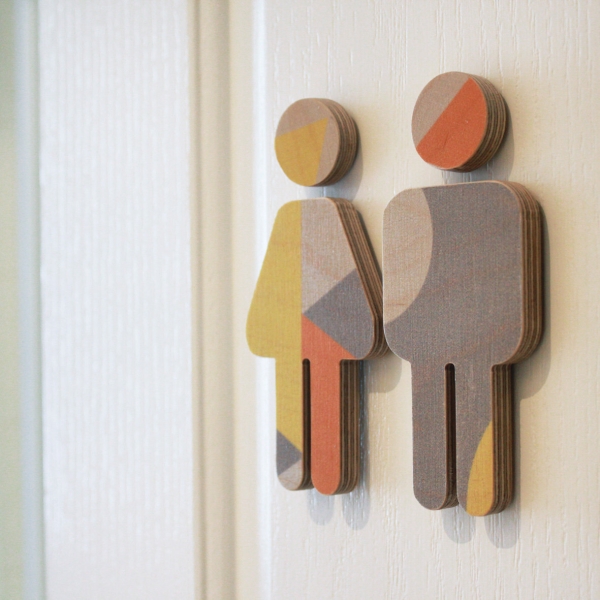 symbols on the toilet's door